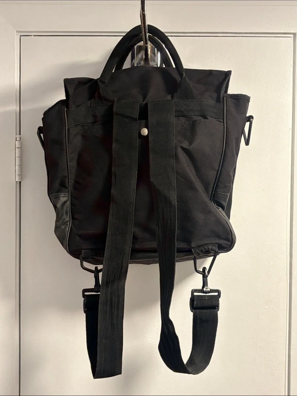 Diesel Vintage Black Canvas Backpack with Red Logo Accent.